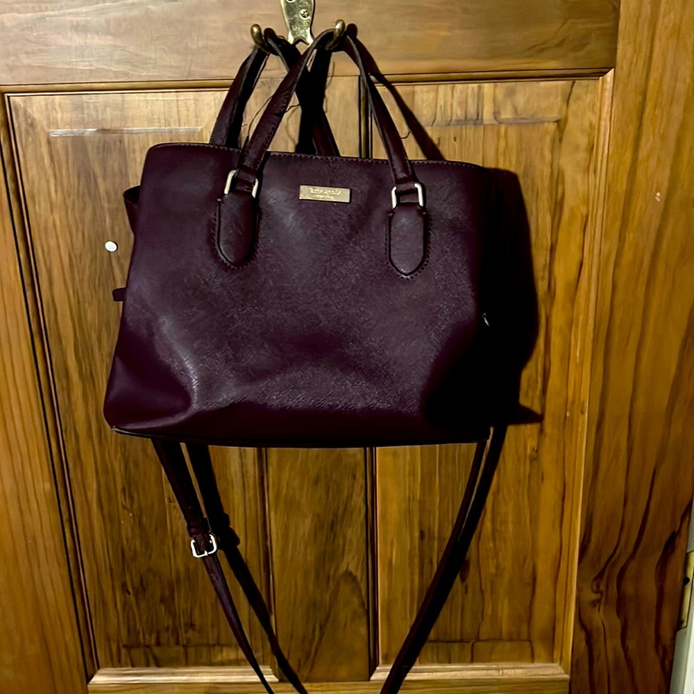 Kate spade eggplant hand bag with cross body strap. Loved but in good condition.